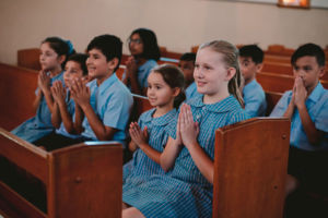 St Mary Star of the Sea Catholic Primary School Hurstville students praying inside church