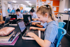 Students using computers in a classroom at St Mary Star of the Sea Catholic Primary School Hurstville